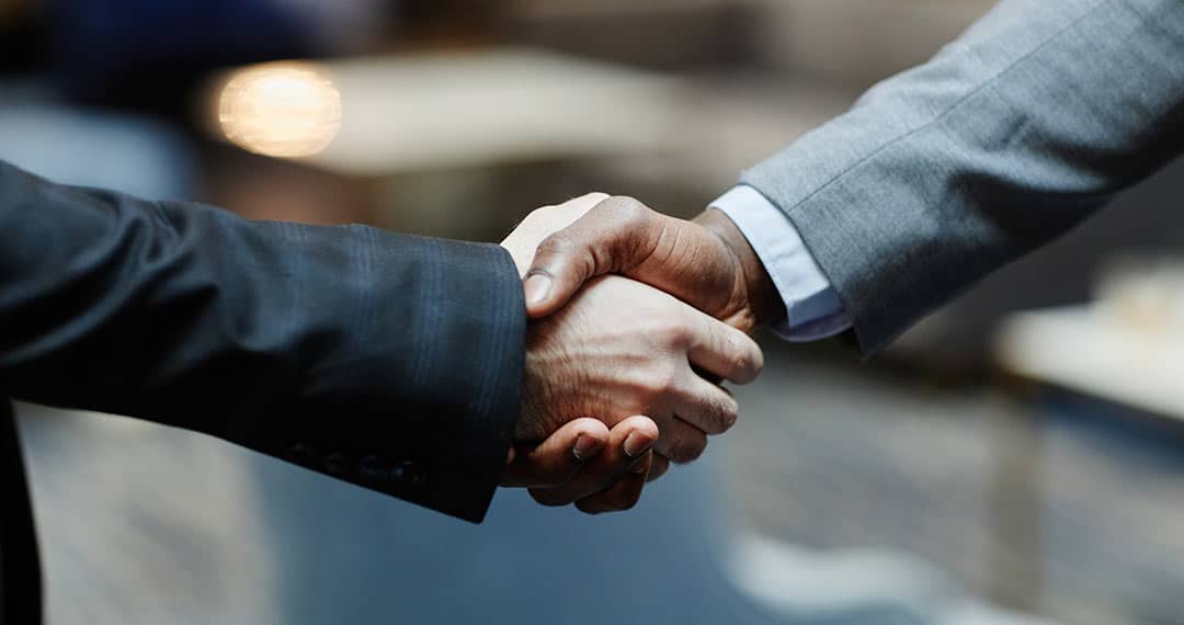 two business people shaking hands