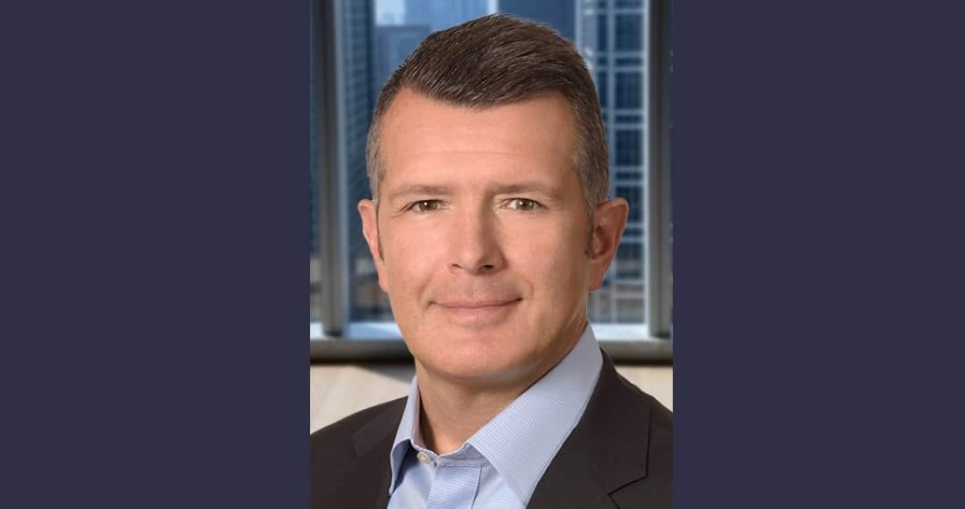 Luke Sarsfield in business attire